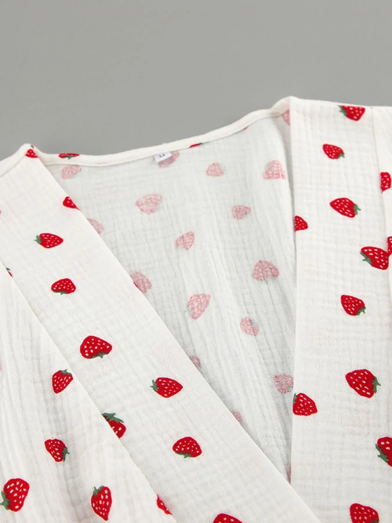 Strawberry-print long-sleeve mini dress, white textured fabric, from Trendsi