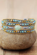 Aqua triple-layer beaded bracelet with teardrop center stone and braided strands