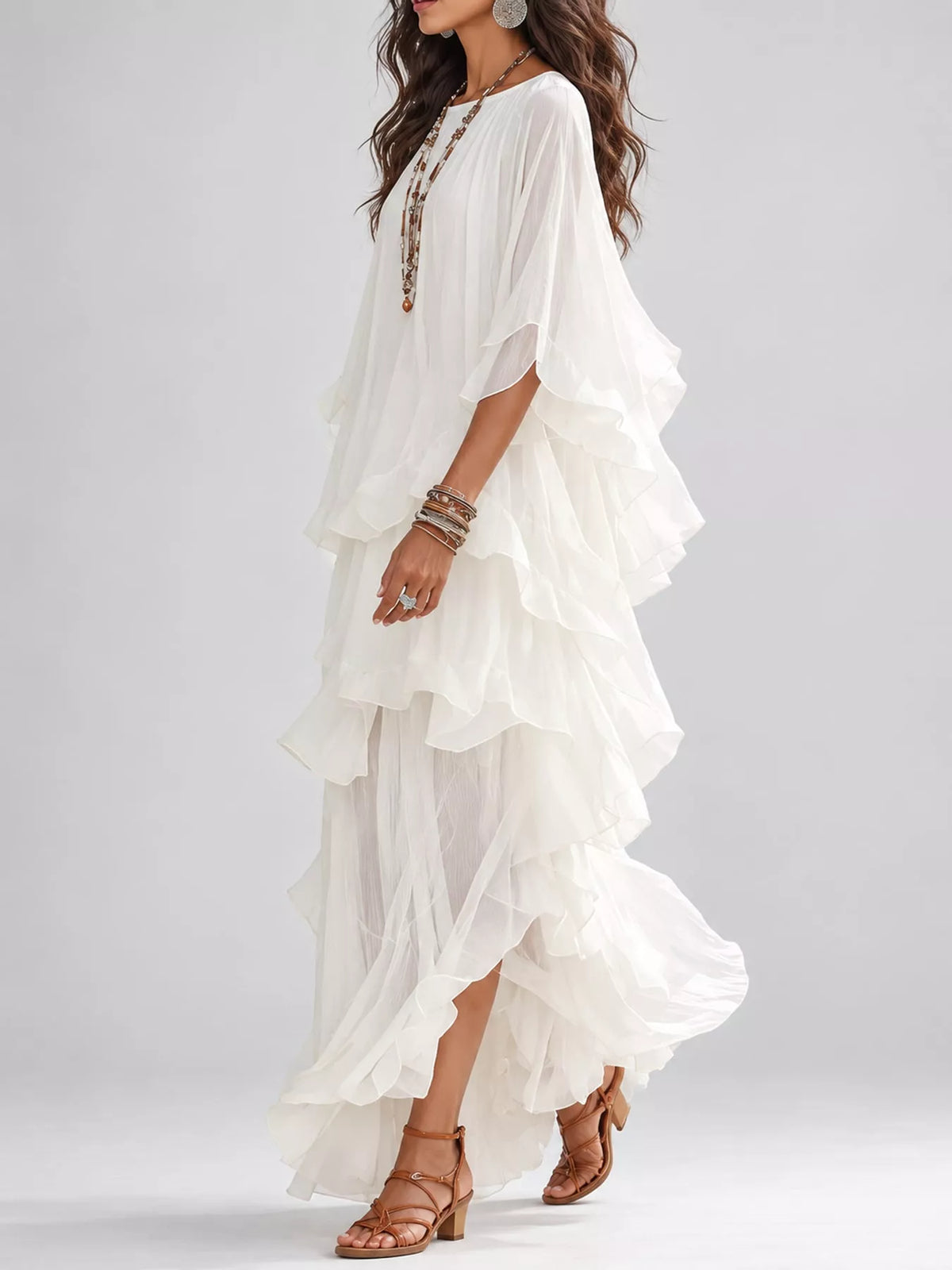 White boho maxi dress with layered ruffles and flowing half sleeves