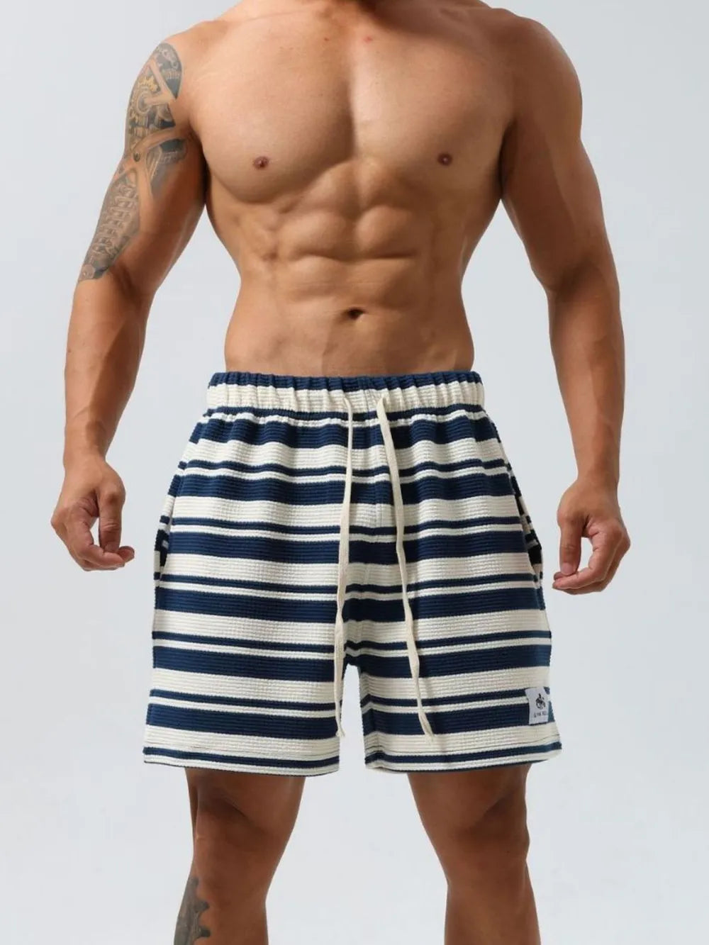 Striped drawstring shorts in navy and white, elastic waistband, front pockets