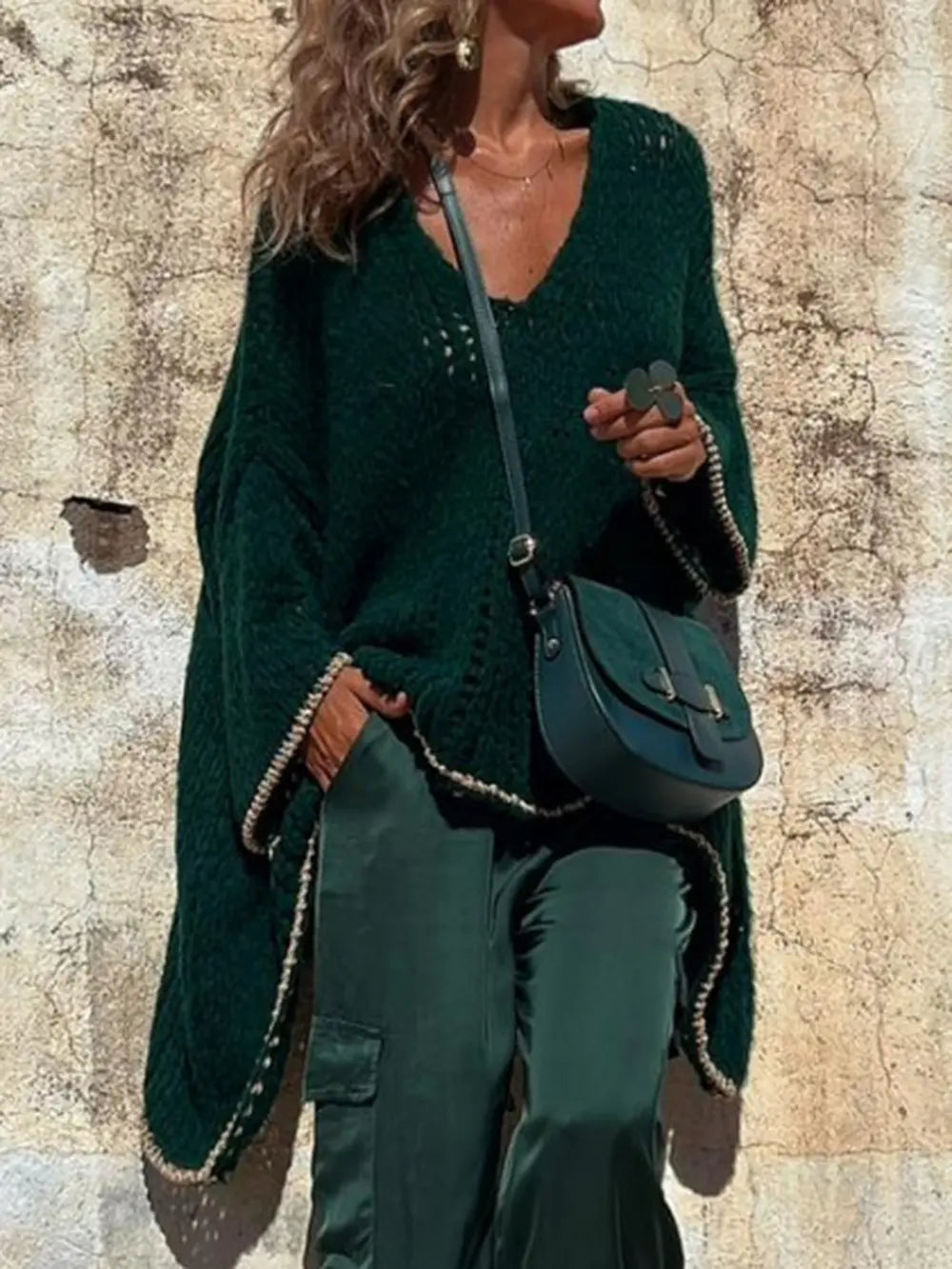 Dark green V-neck long sleeve sweater in open knit with relaxed drape