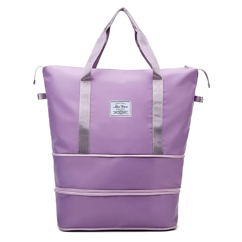 Lavender large duffle bag with top handles, side straps, and zippered front panel