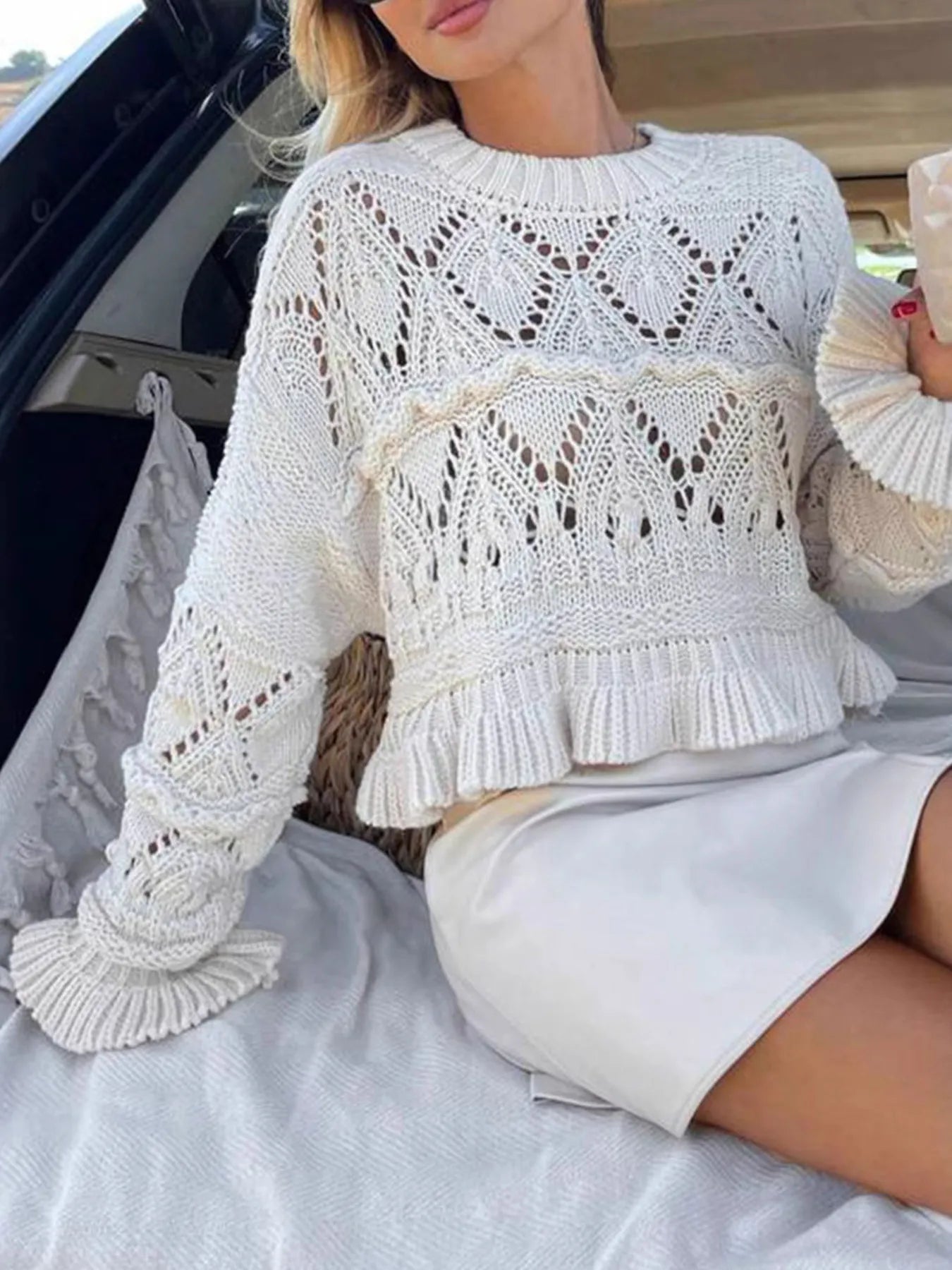 White crochet long sleeve sweater with ruffled waist and openwork diamond knit center panel