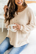 Cream waffle knit long sleeve henley top with button placket and side slit hem