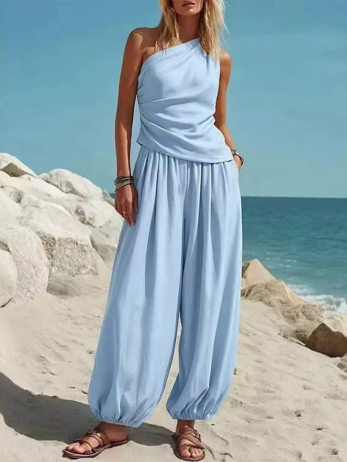 Light blue one-shoulder sleeveless top and wide-leg harem pants set with gathered waist