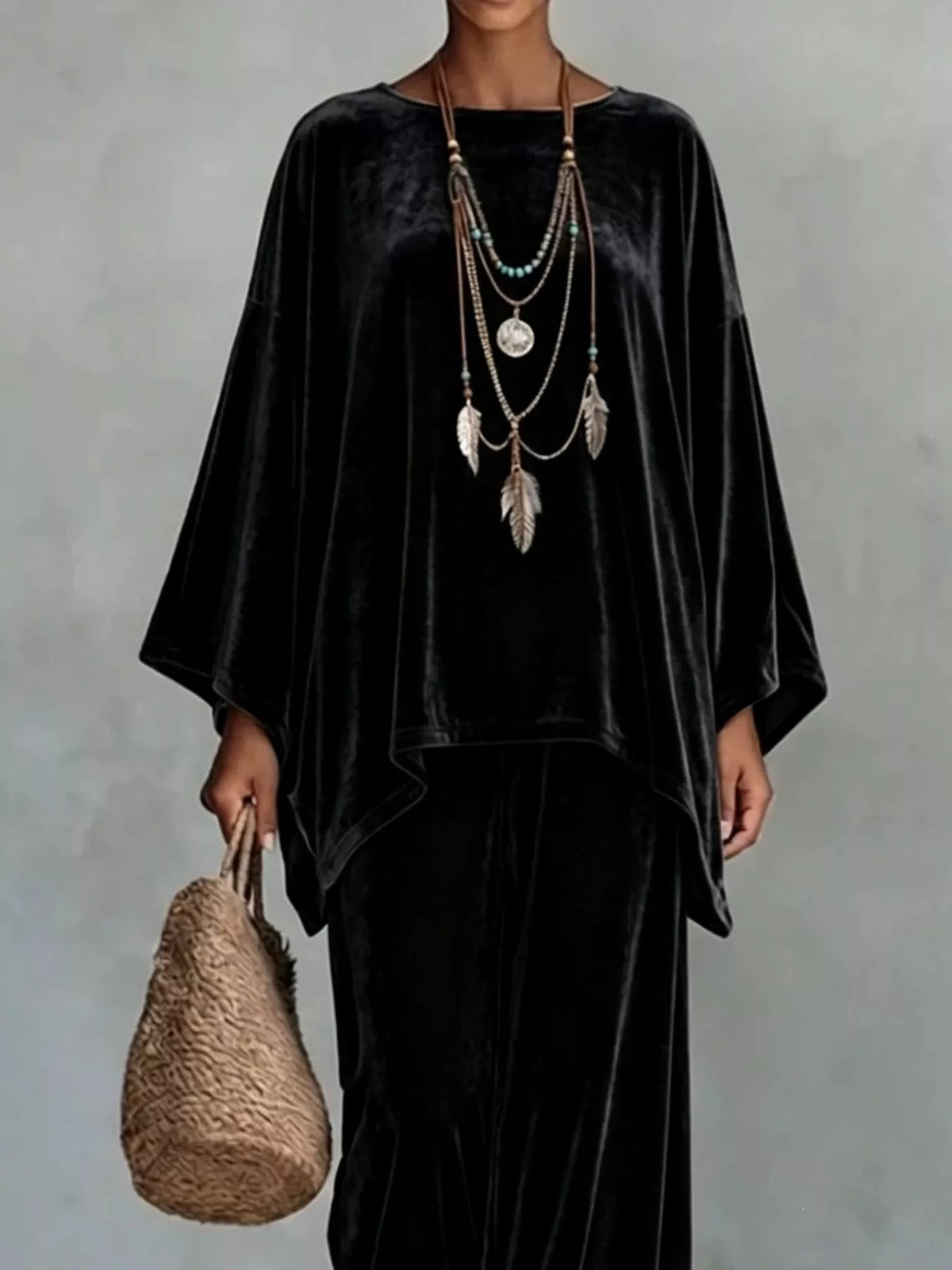 Black velvet asymmetrical poncho top with matching wide-leg pants