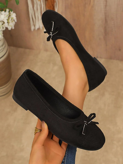 Black bow-detail slip-on loafers with tied bow at toe and low profile