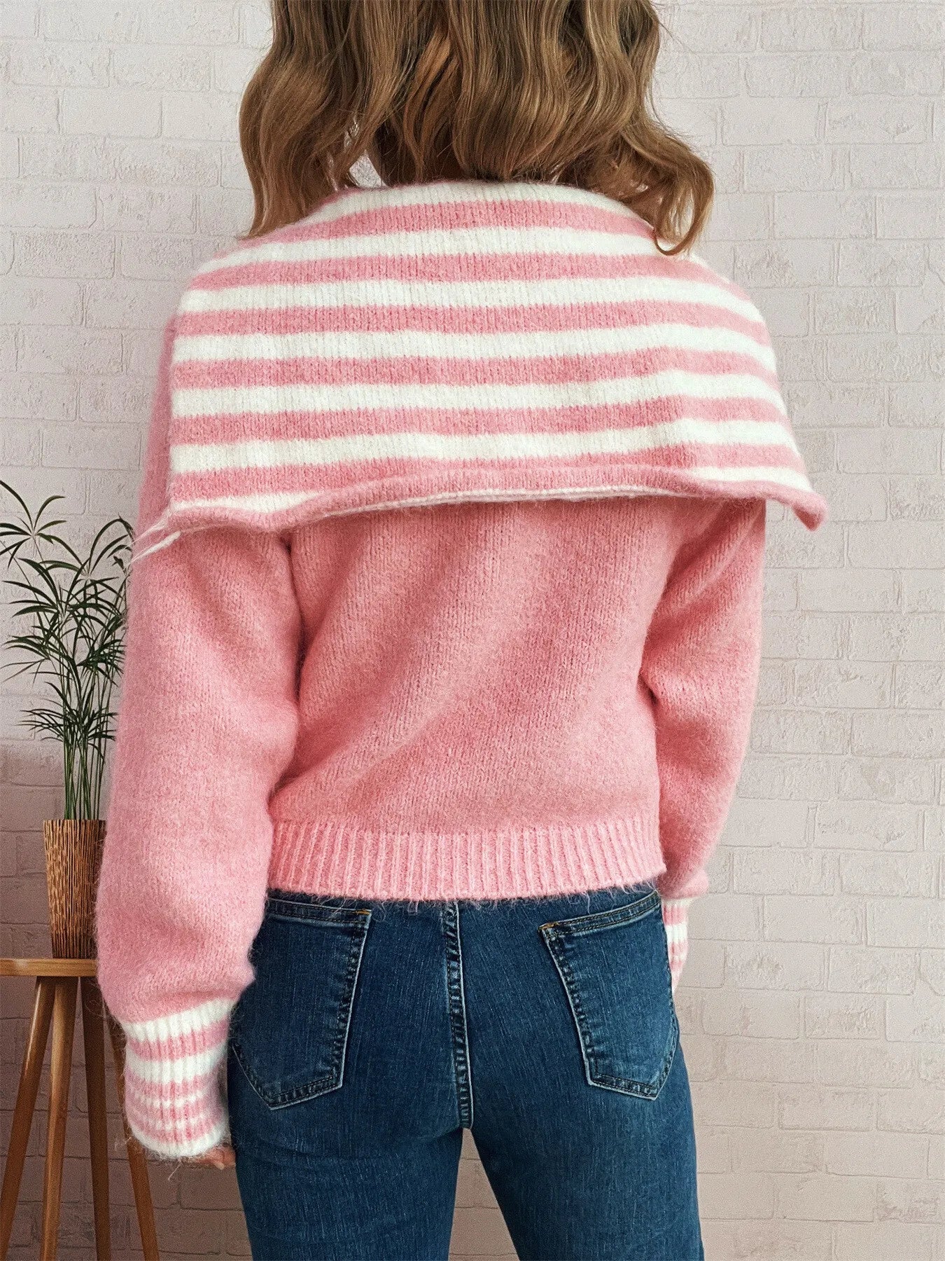 Pink zip-up cardigan back with horizontal striped yoke and ribbed cuffs