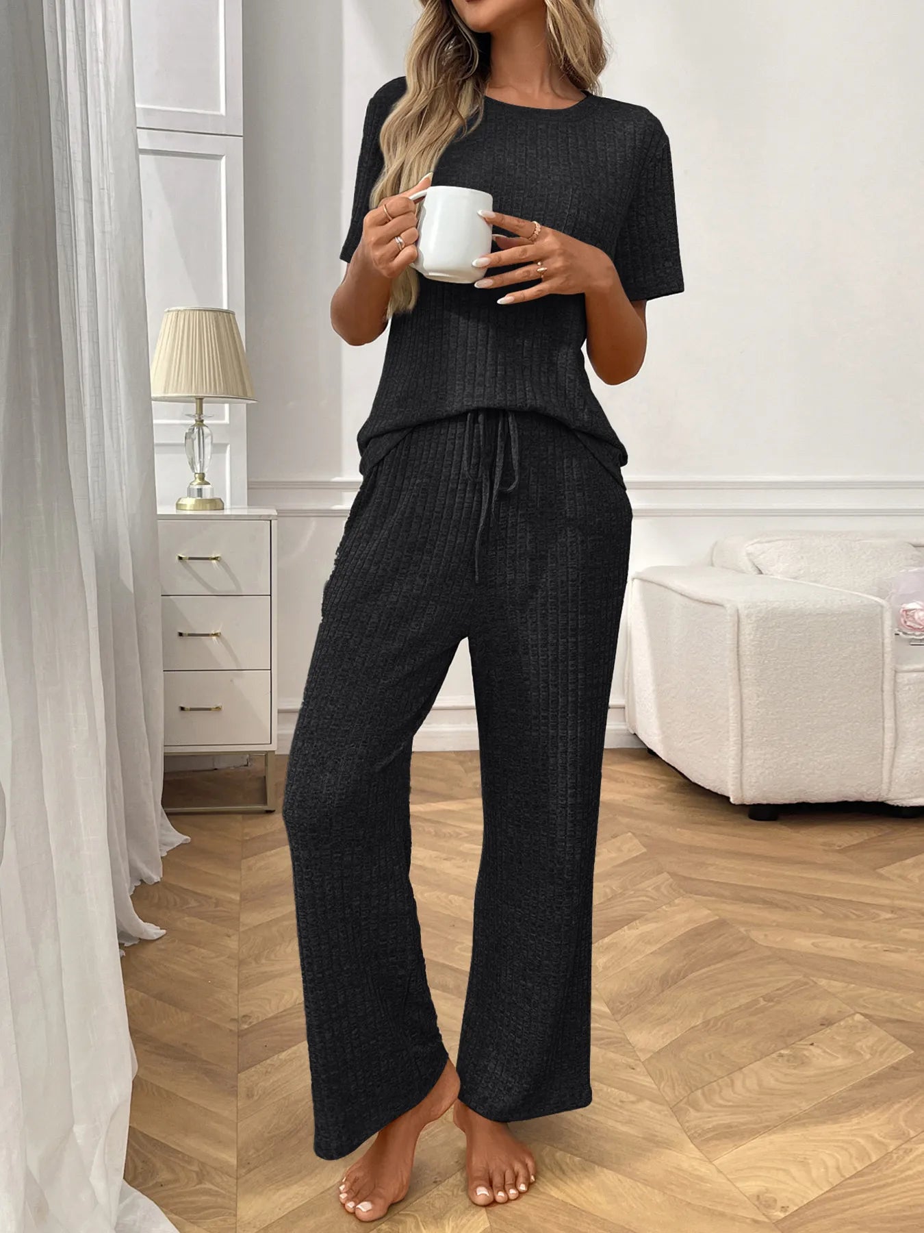 Ribbed knit lounge set with short-sleeve top and wide-leg pants, black, front view