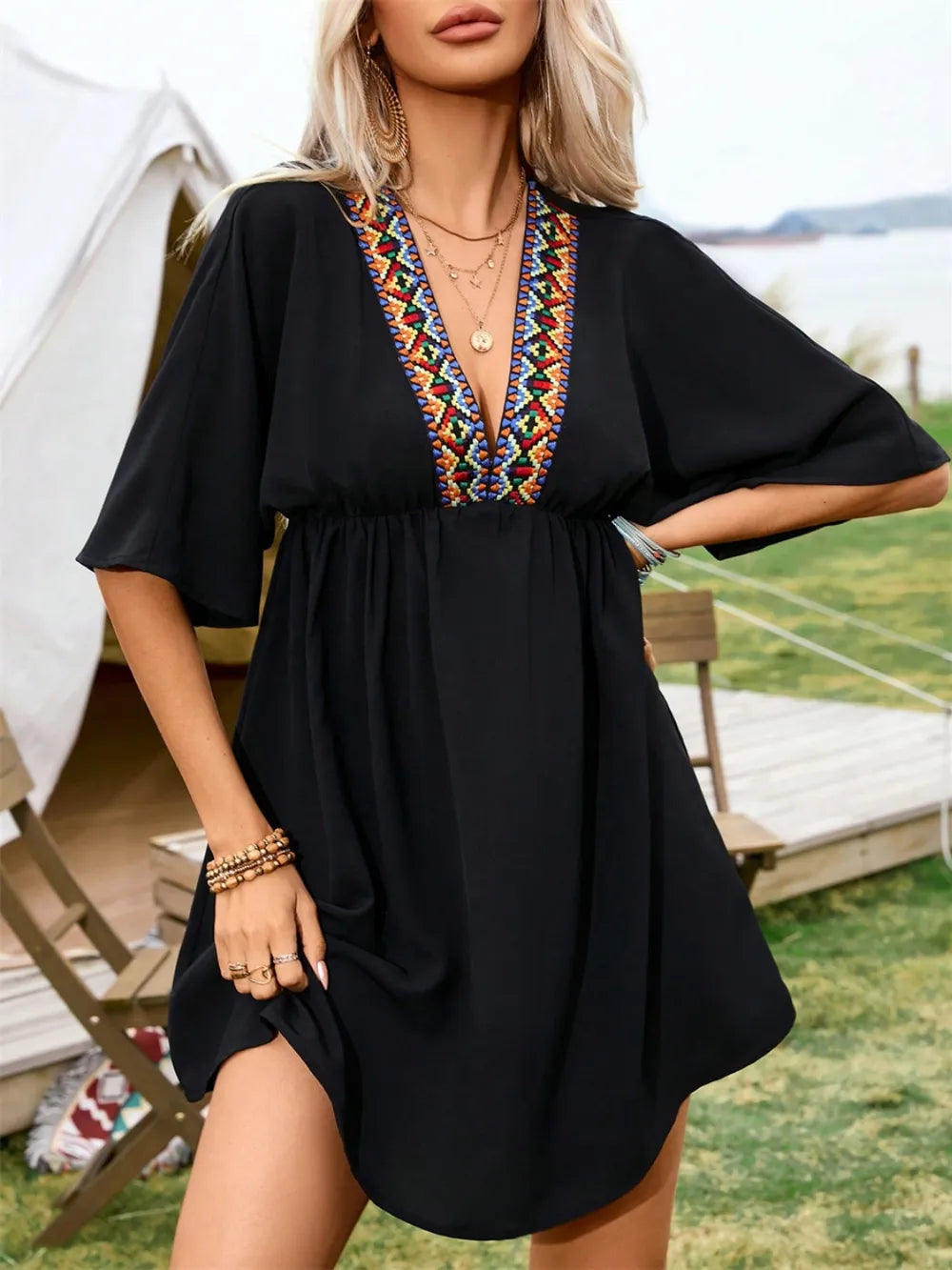 Dress Trendsi black embroidered plunge-neck mini dress with half sleeves and colorful neckline trim.