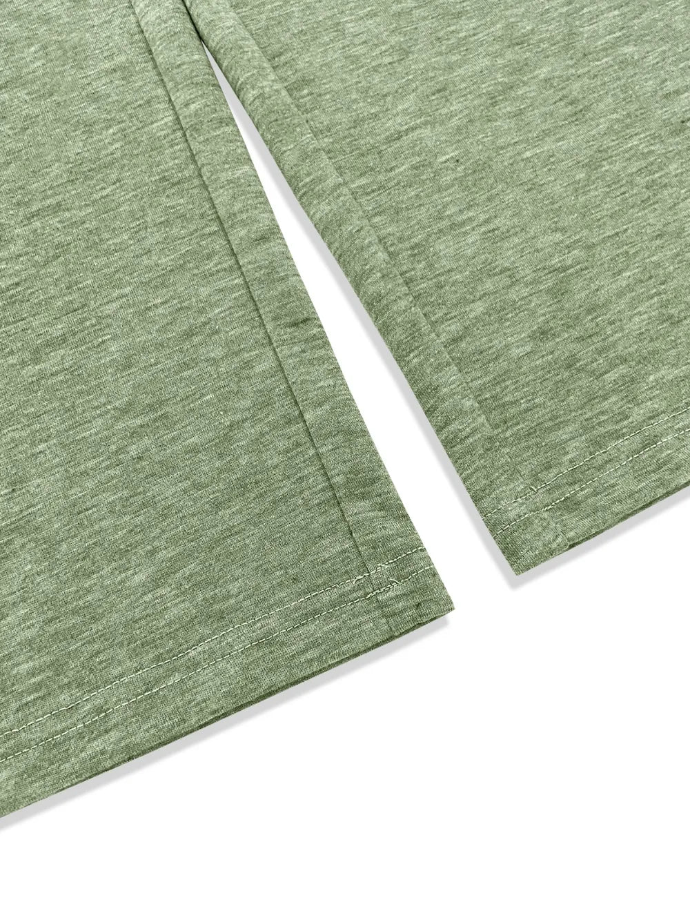 Matcha green wide-leg pants with angled hem and textured fabric close-up