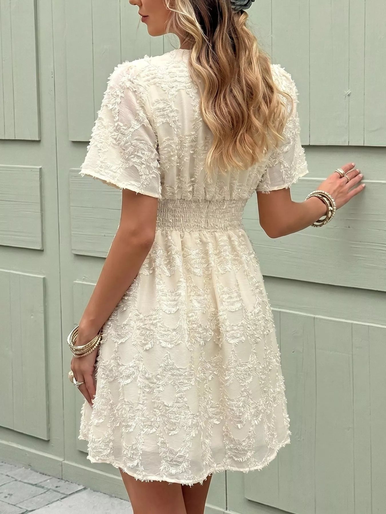 Cedar & Moore Textured V-Neck Mini Dress by Trendsi, cream lace texture, ruched smocked waist, short puff sleeves