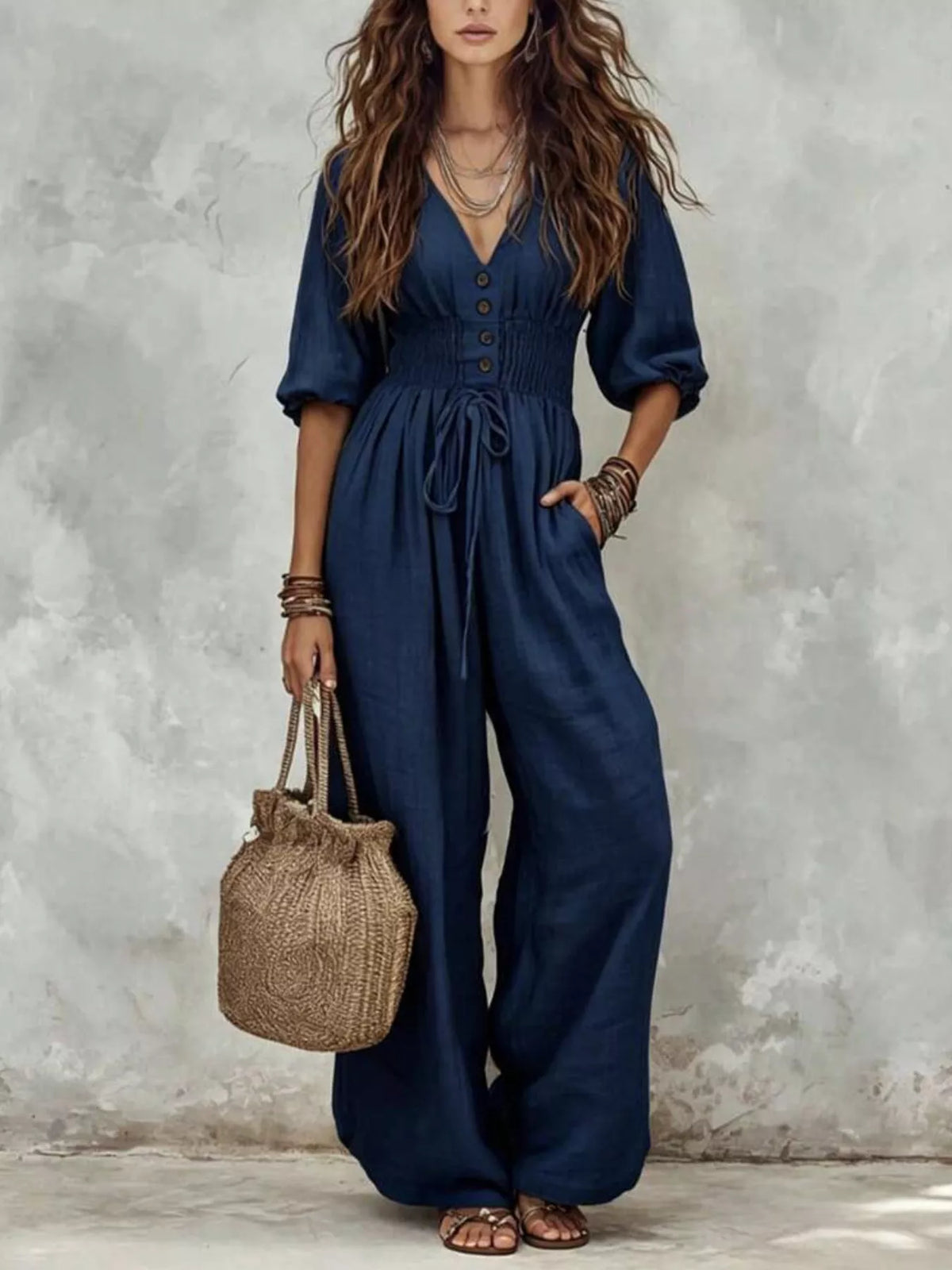 Navy v-neck smocked-waist wide-leg jumpsuit with button front and pockets