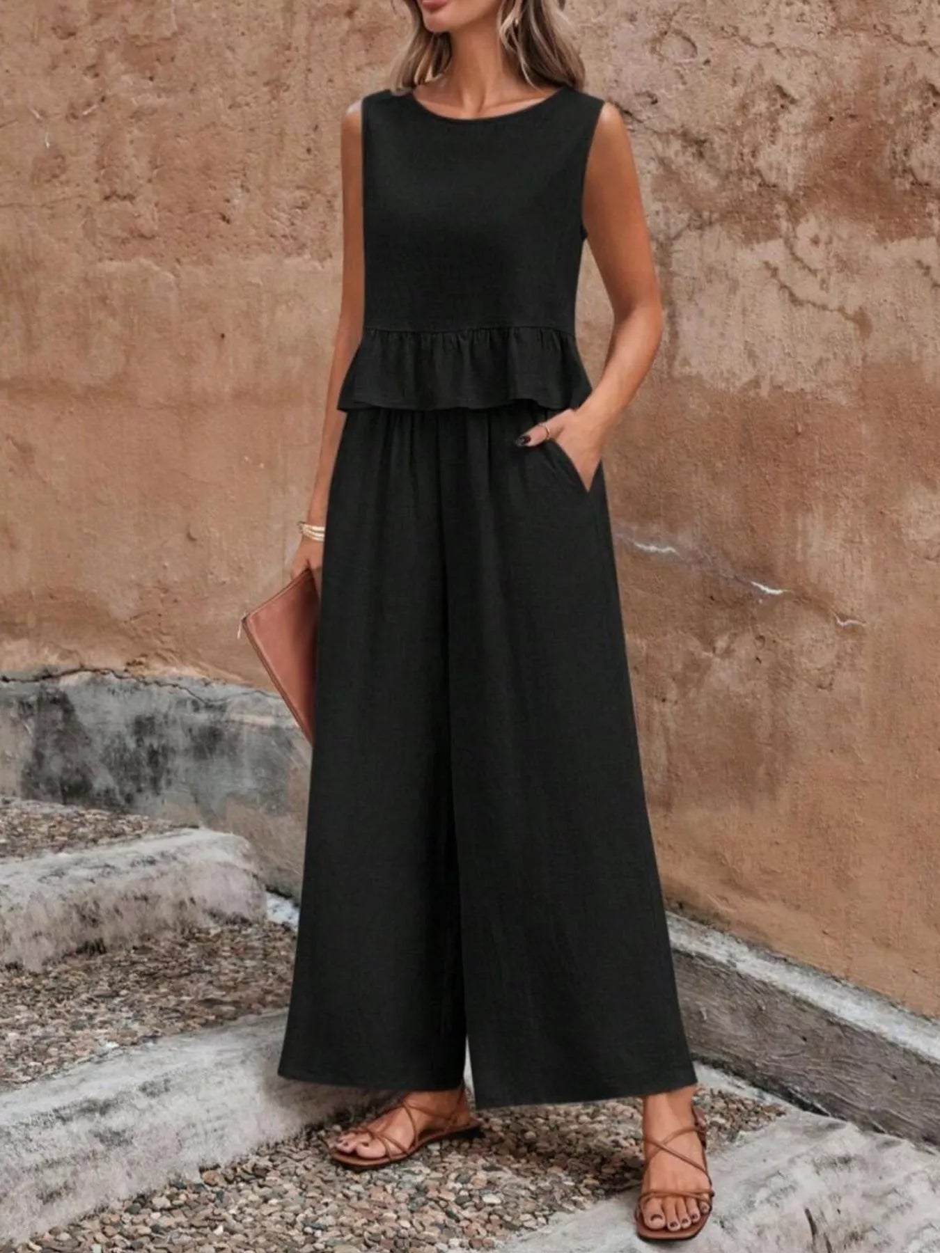 Black sleeveless ruffle hem top and wide-leg pants set with tiered bodice