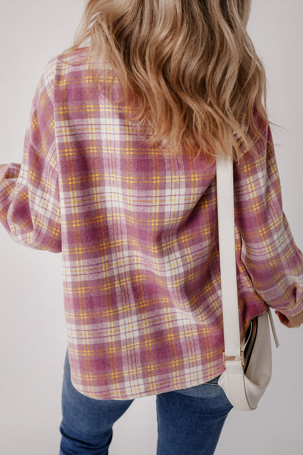Pink plaid shacket with long sleeves and button-back style seam
