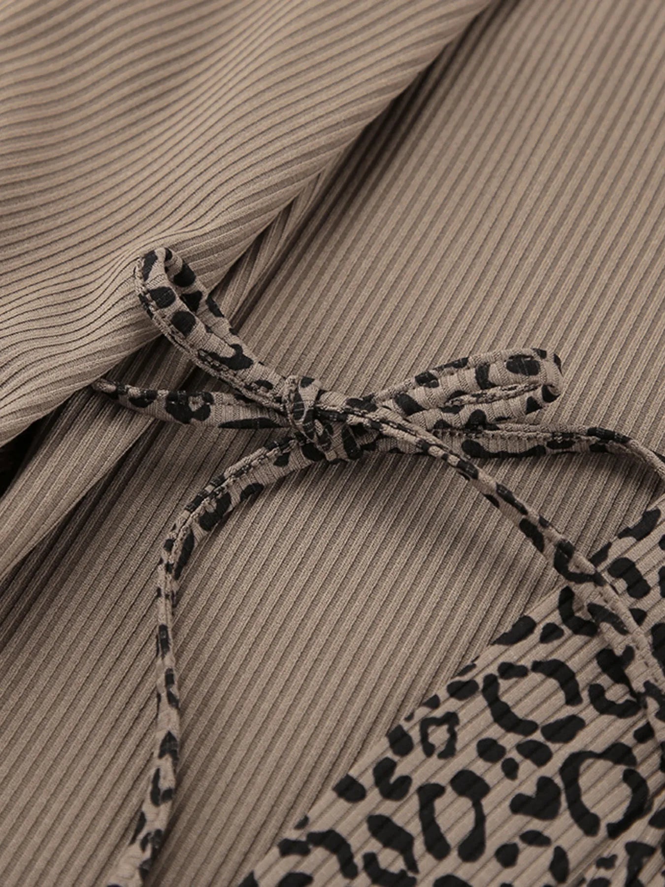Leopard print cardigan fabric detail with tie at neckline