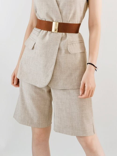Elastic belt with alloy buckle on model, rust-brown strap with gold-tone buckle