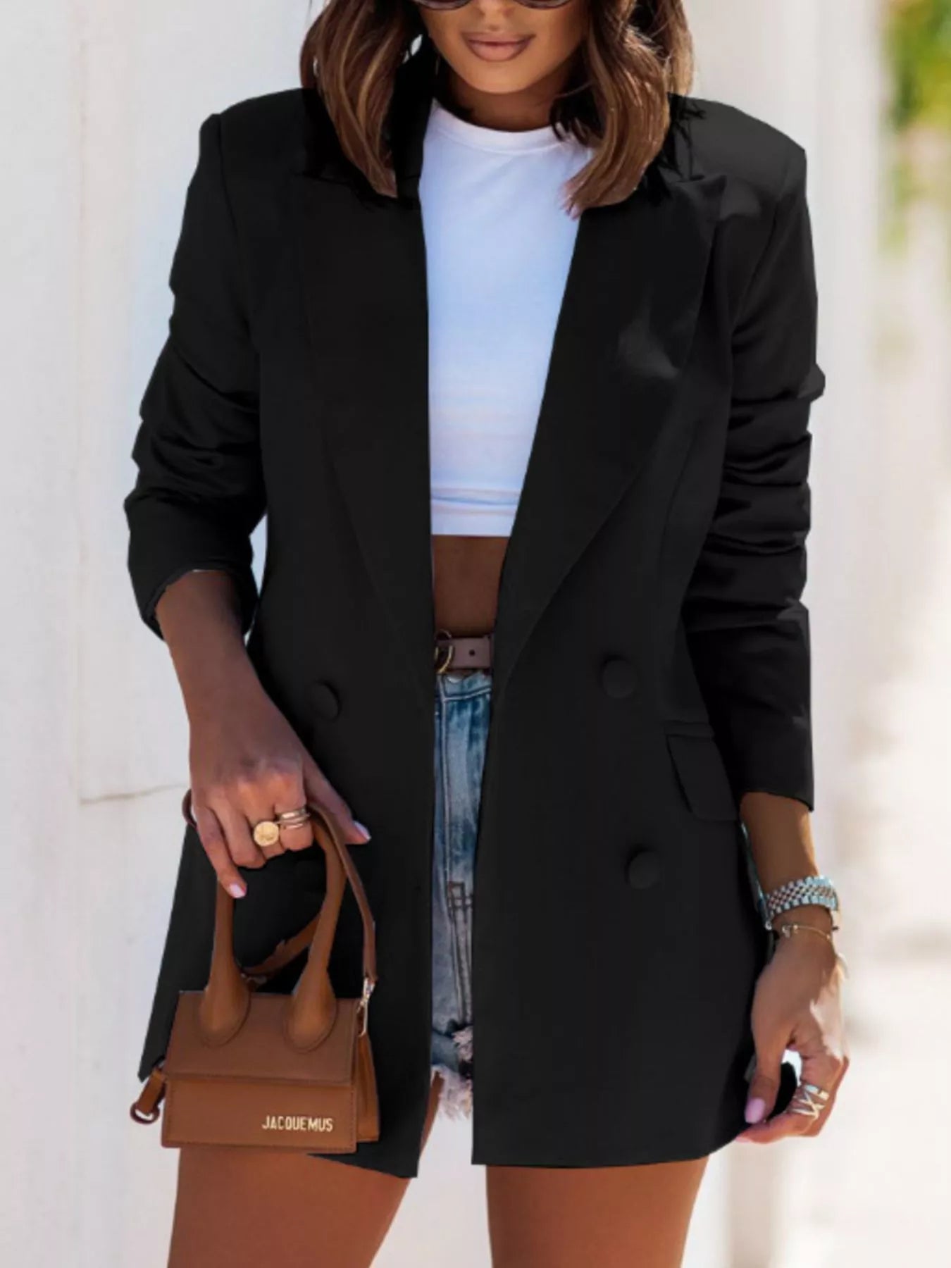 Black lapel long-sleeve blazer with double-breast button front and pocket flaps