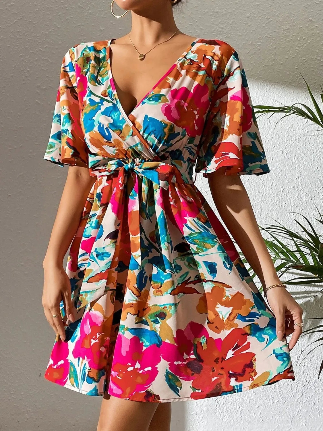 Printed surplice short-sleeve multicolor floral mini dress with belted waist