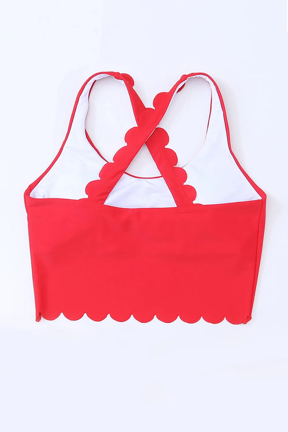 Red crisscross swim top with scalloped hem and crossed back straps