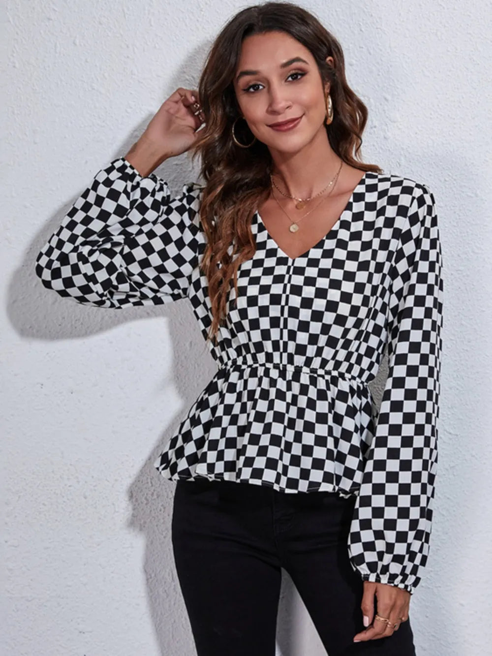 Checkered V-neck peplum blouse with long balloon sleeves and gathered waist, black/white