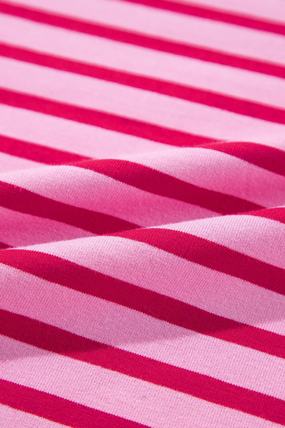 Fuchsia pink and white striped knit fabric close-up