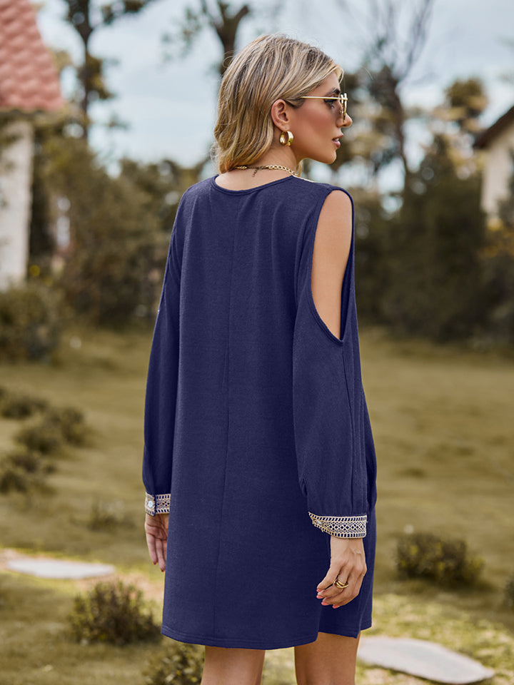 Navy V-neck cutout sleeve mini dress, back view with cutout shoulder detail