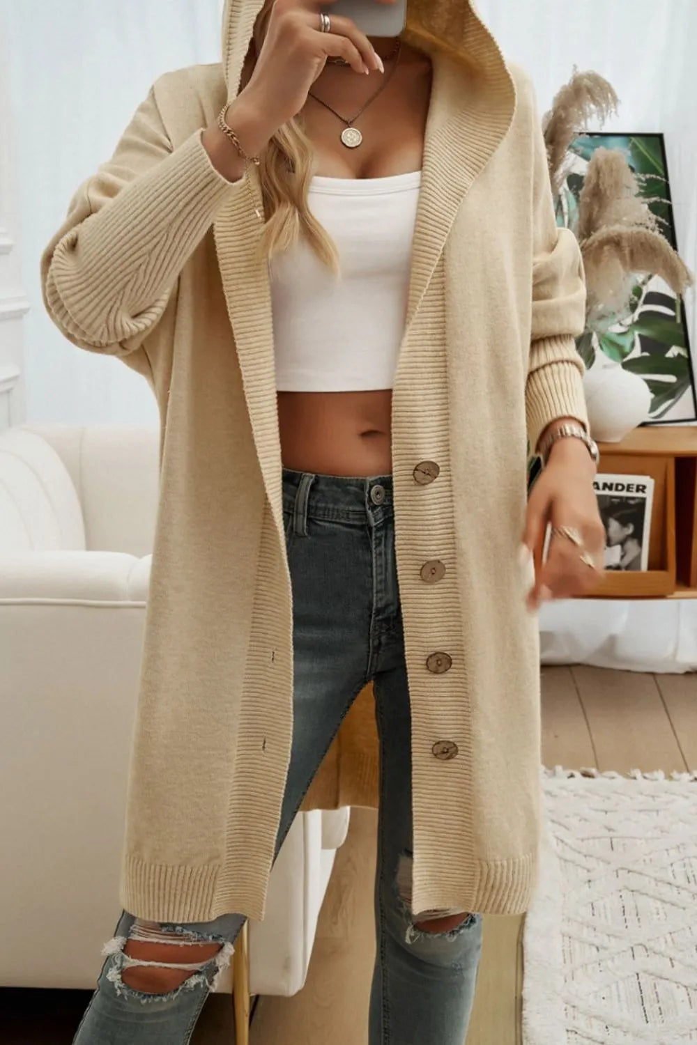 Tan hooded long cardigan with button front and ribbed knit long sleeves.