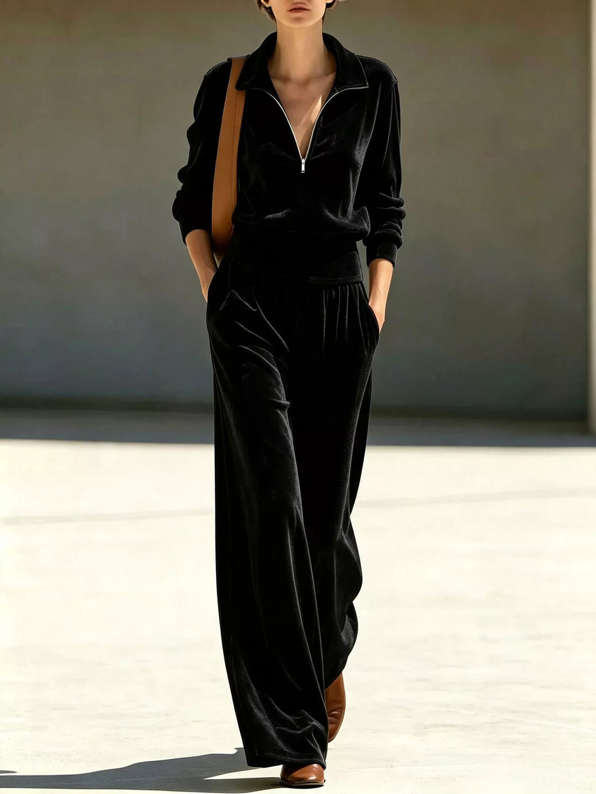 Black quarter-zip top and wide-leg pants set with drawstring waist