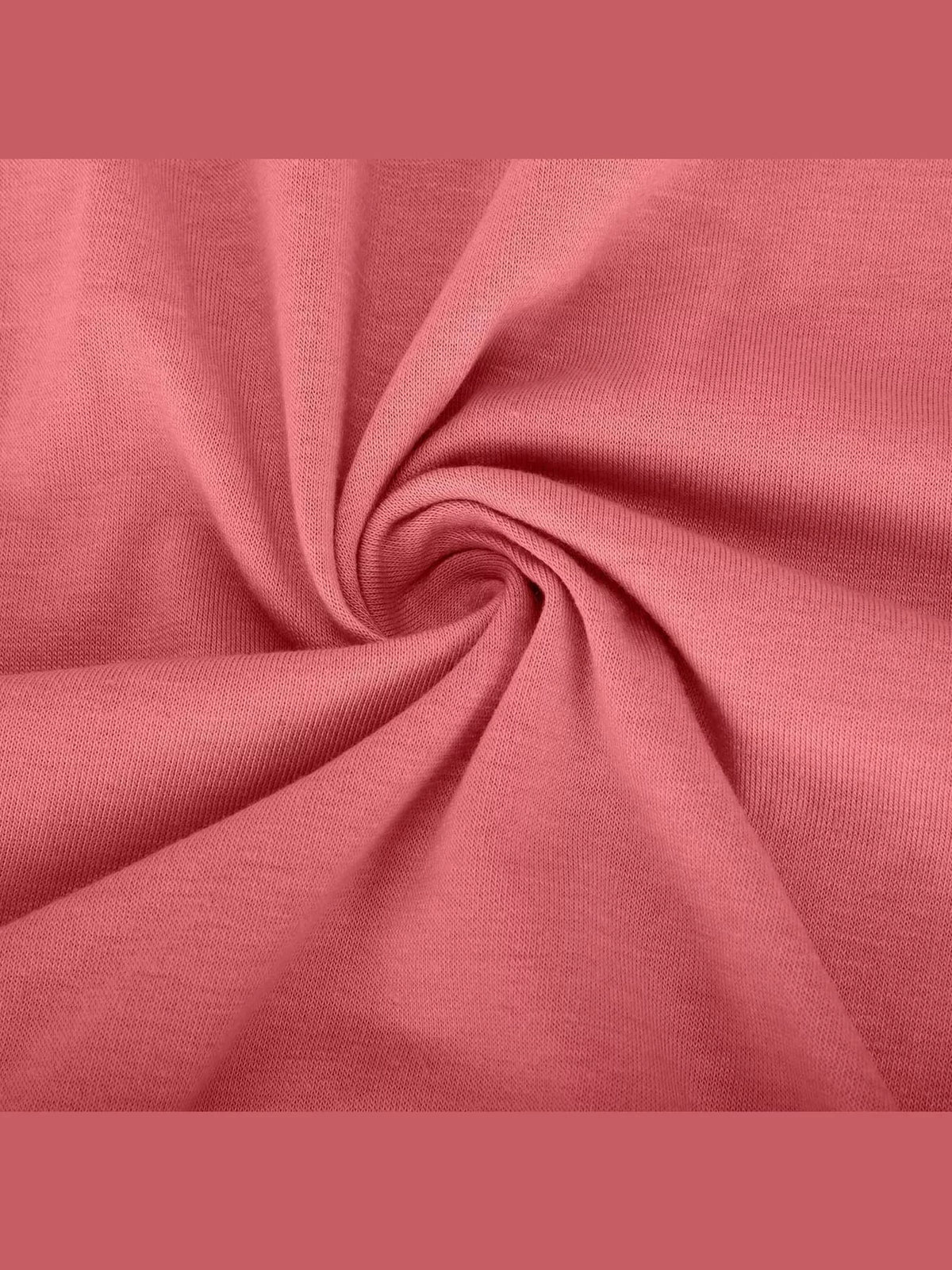 Watermelon red knit fabric close-up with soft drape and folded texture