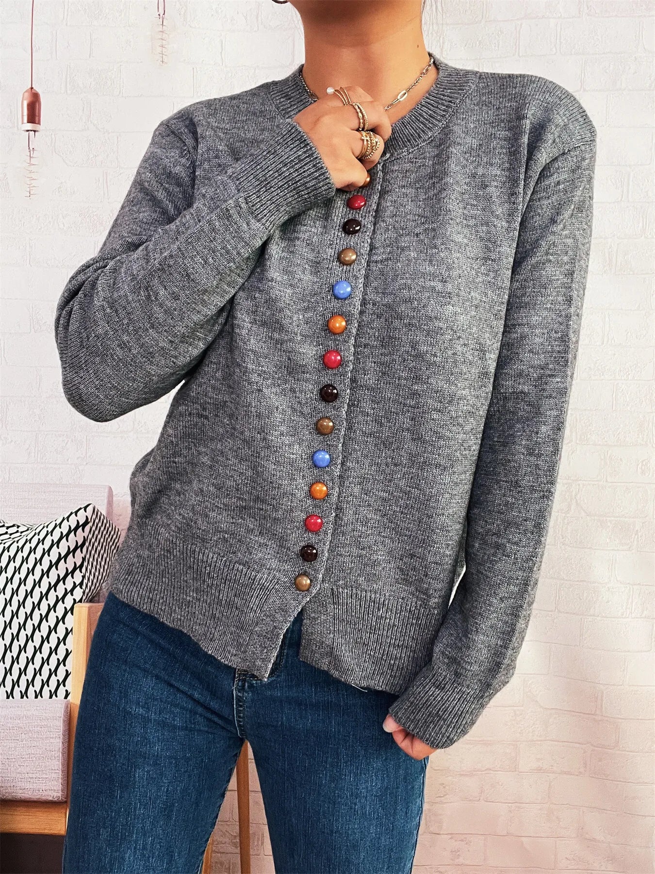 Gray ribbed knit cardigan with long sleeve and vertical colorful button placket