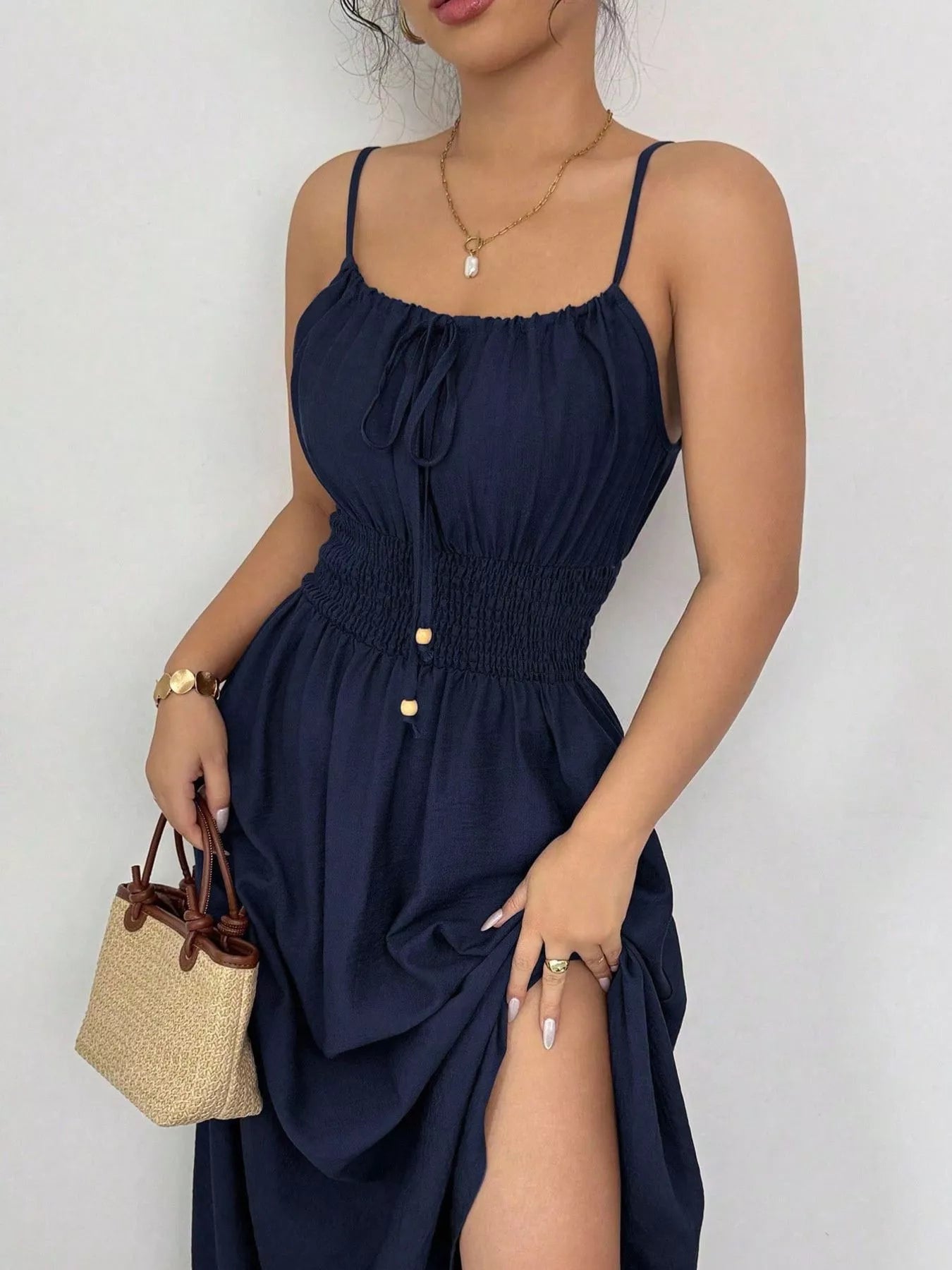 Smocked spaghetti strap midi dress in navy with gathered bodice and front button details