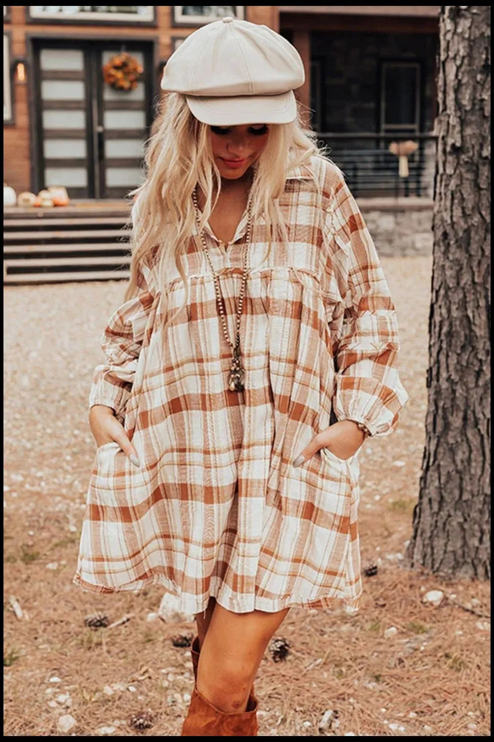 Plaid collared mini shirt dress with long sleeves, button front, and chest pockets