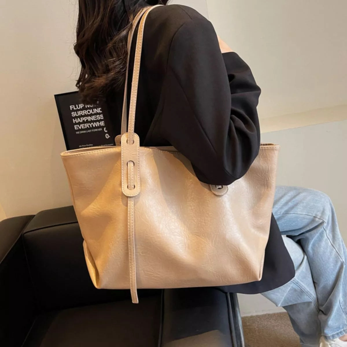 Khaki vegan leather tote bag with adjustable shoulder strap and long center handle panel