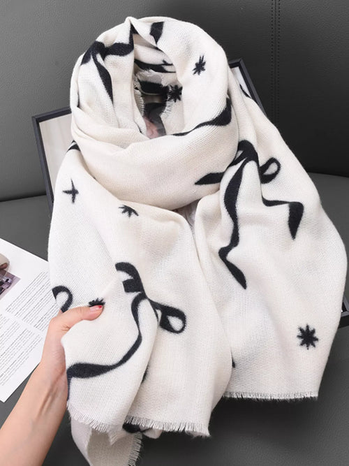 Lightweight scarf with bow print, white with black motifs and fringed ends