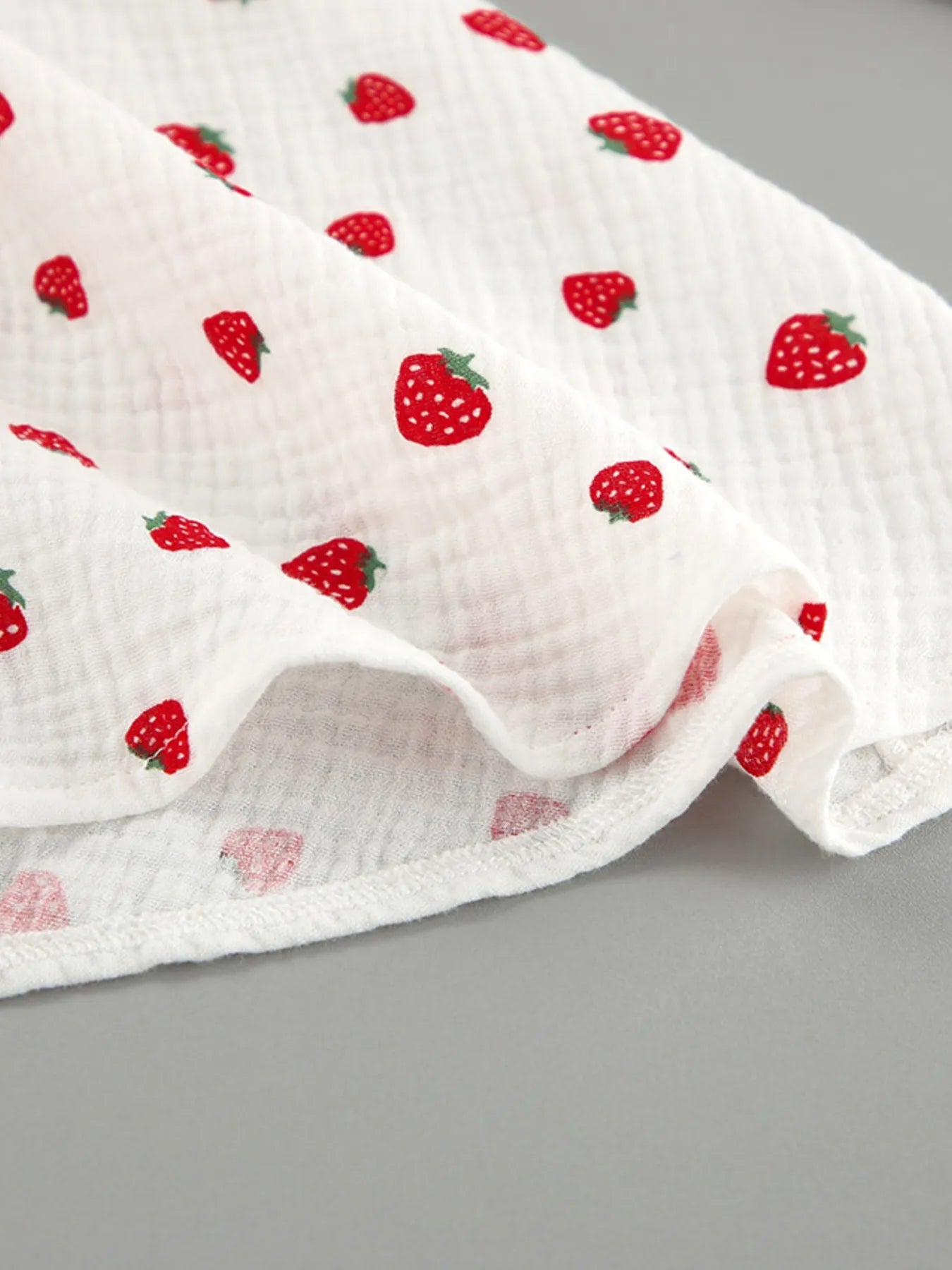 Strawberry Print Long Sleeve Mini Dress on white fabric with red strawberry pattern