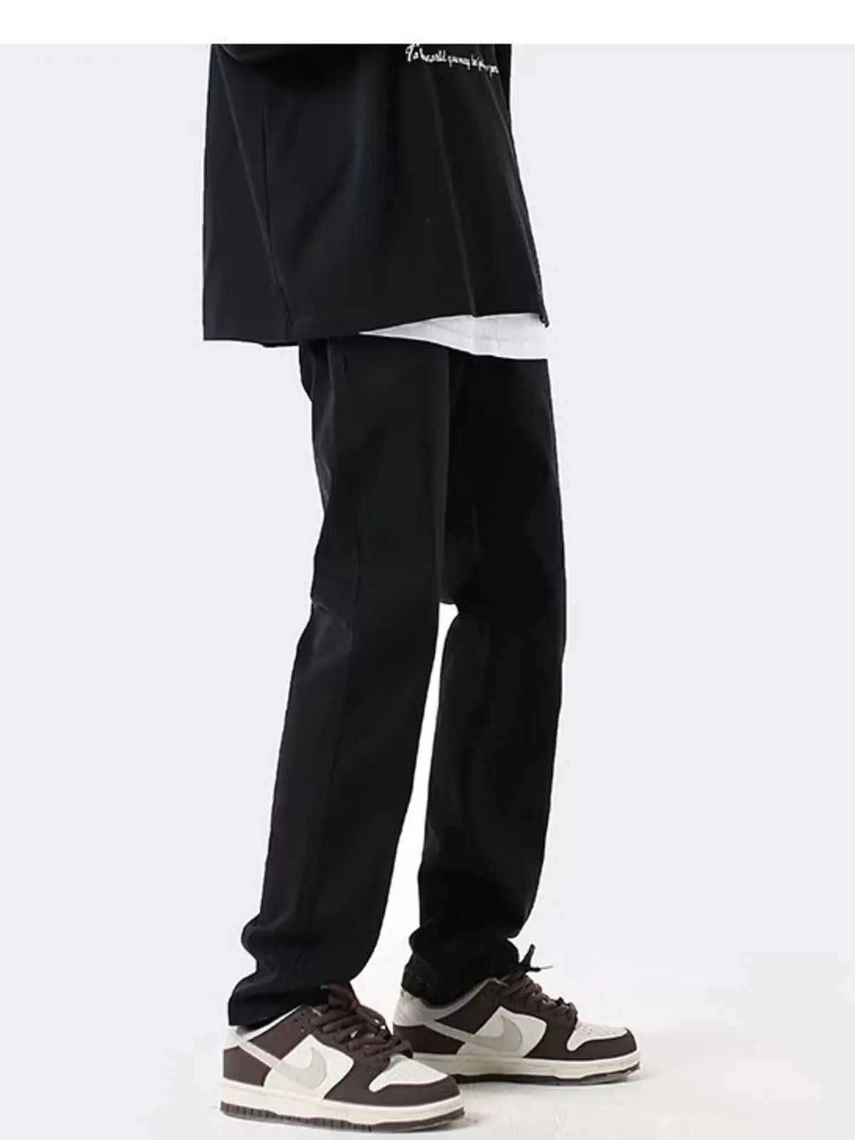Black slim-fit cotton stretch jeans with tapered leg opening and ankle hem