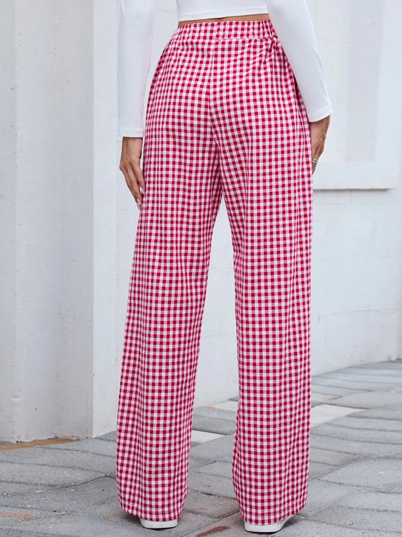 Plaid wide-leg casual pants in red and white, side view with full-length wide legs.