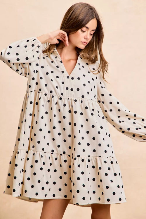 Ivory polka dot V-neck dress with collared neckline, long puff sleeves, tiered layers