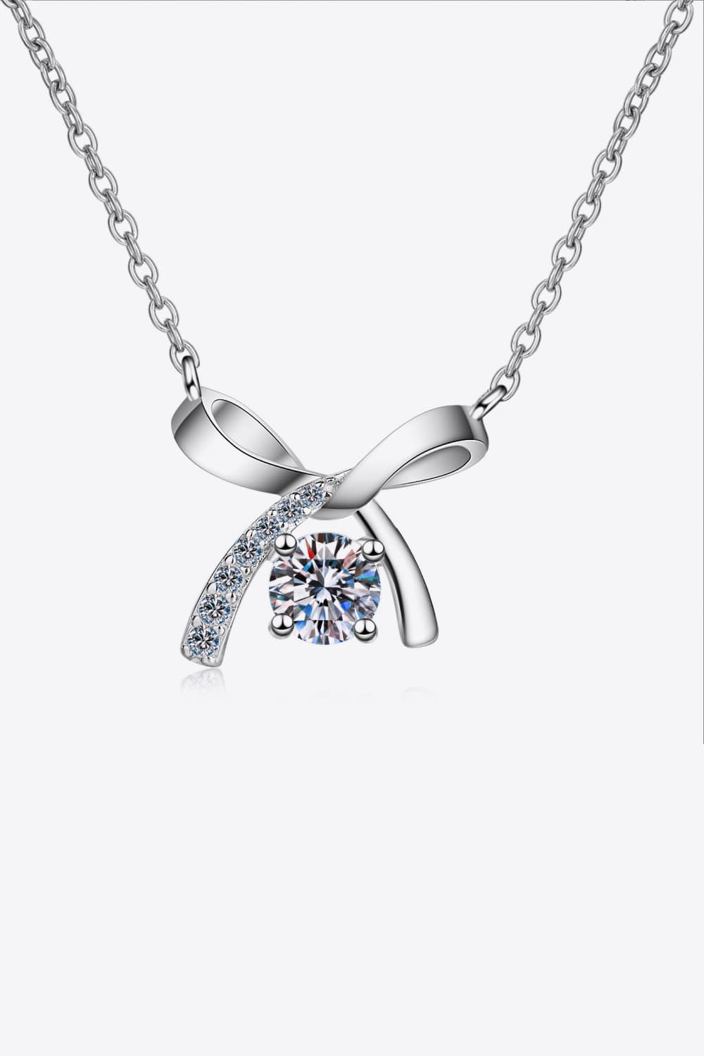 Moissanite sterling silver necklace with bow pendant and round moissanite center gemstone