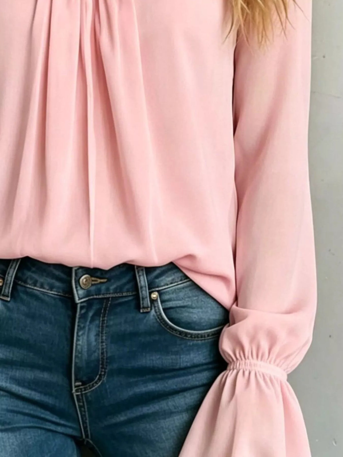 Dusty pink v-neck polyester blouse with gathered cuffs and flowy gathered front panels