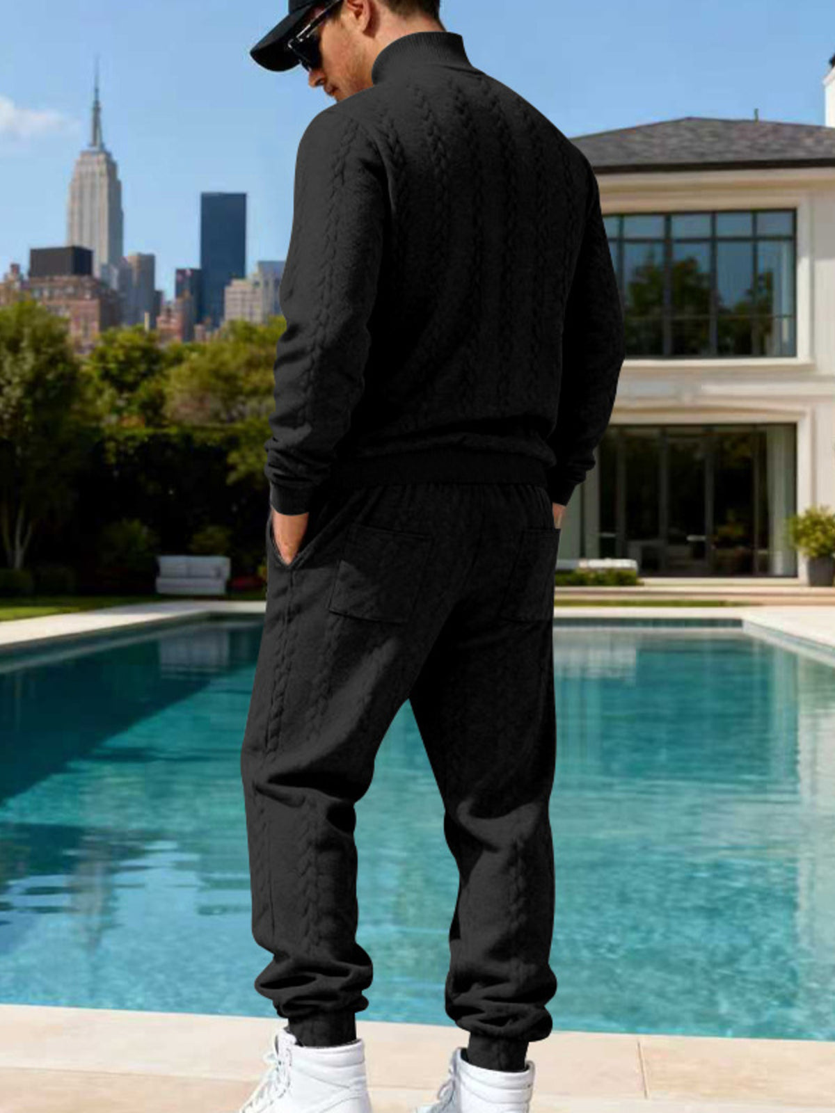 Men's black cable-knit mock neck sweater and jogger set, back view