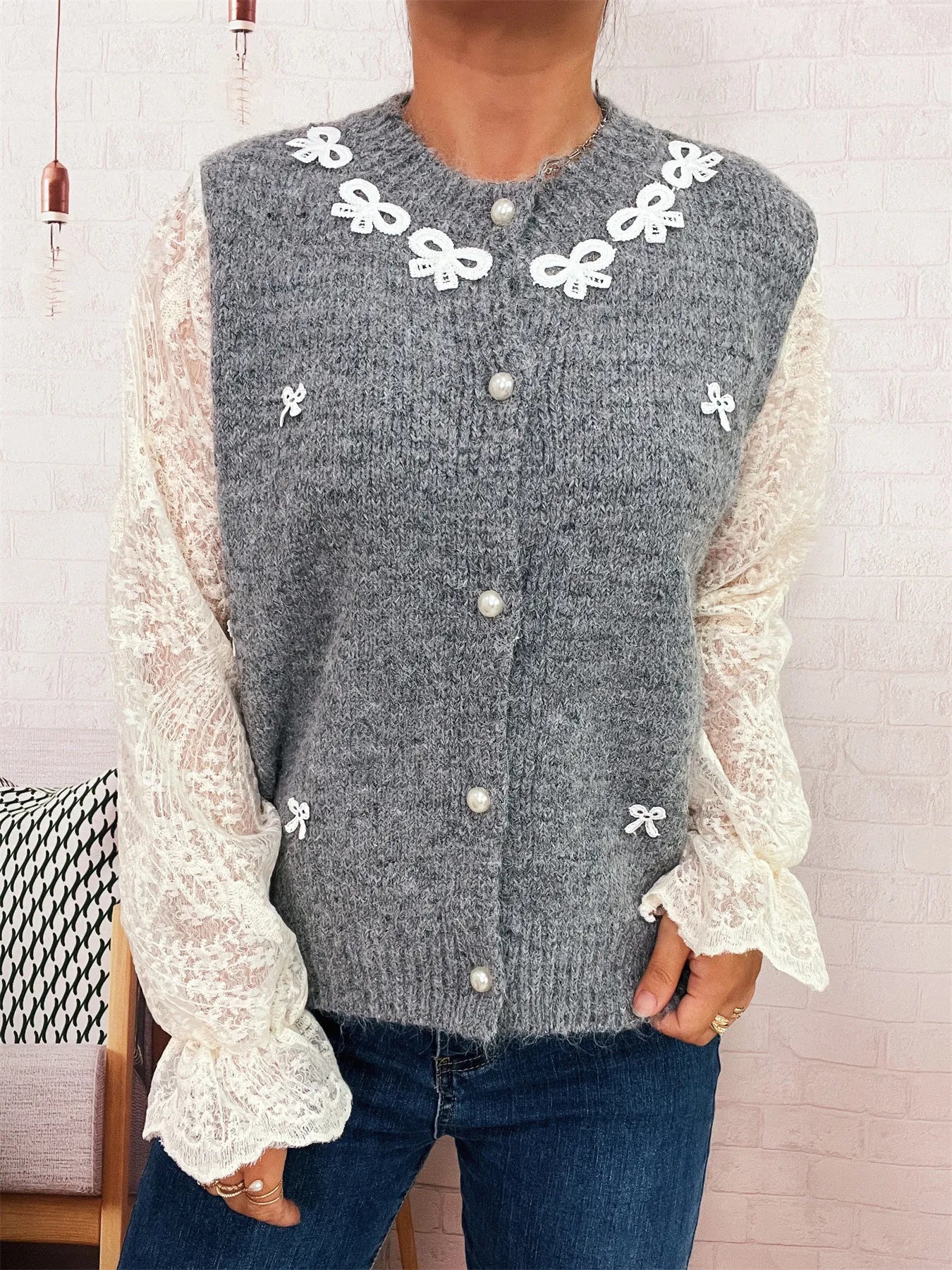 Gray lace-sleeve button-up cardigan with flower bow trim and pearl-style buttons