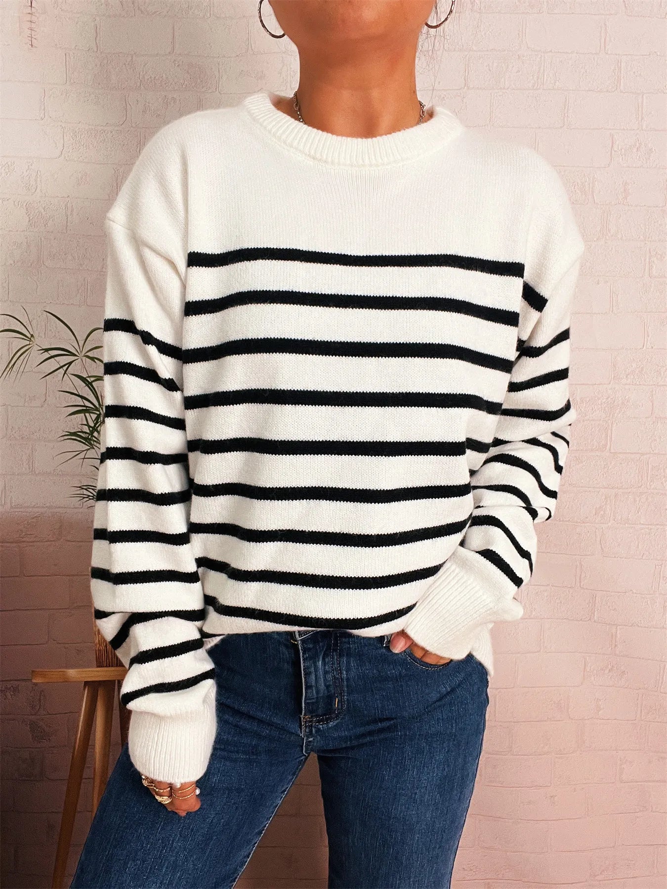 White striped drop-shoulder sweater, black horizontal stripes, ribbed neckline