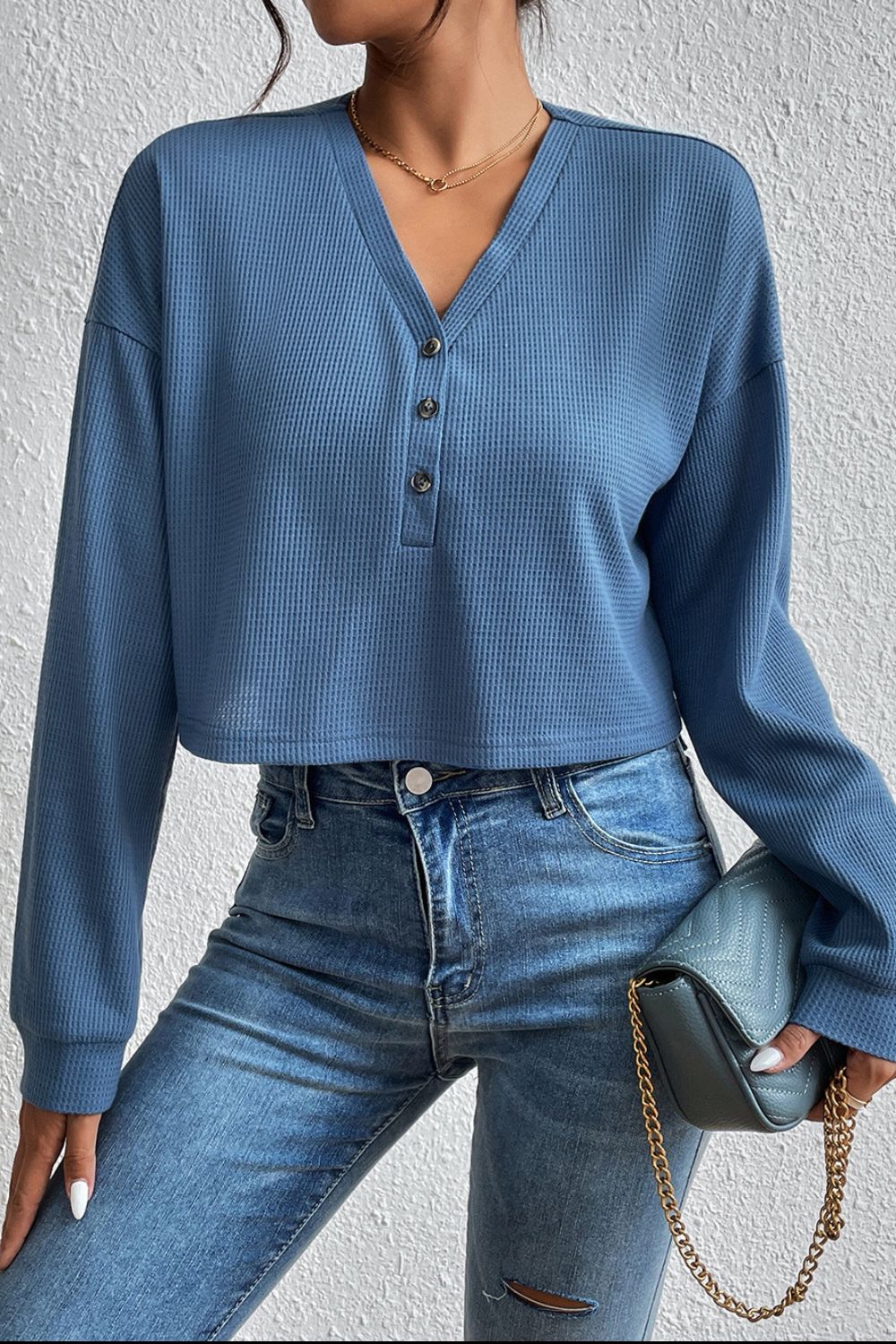 Dusty blue cropped V-neck raglan sleeve blouse with front button row