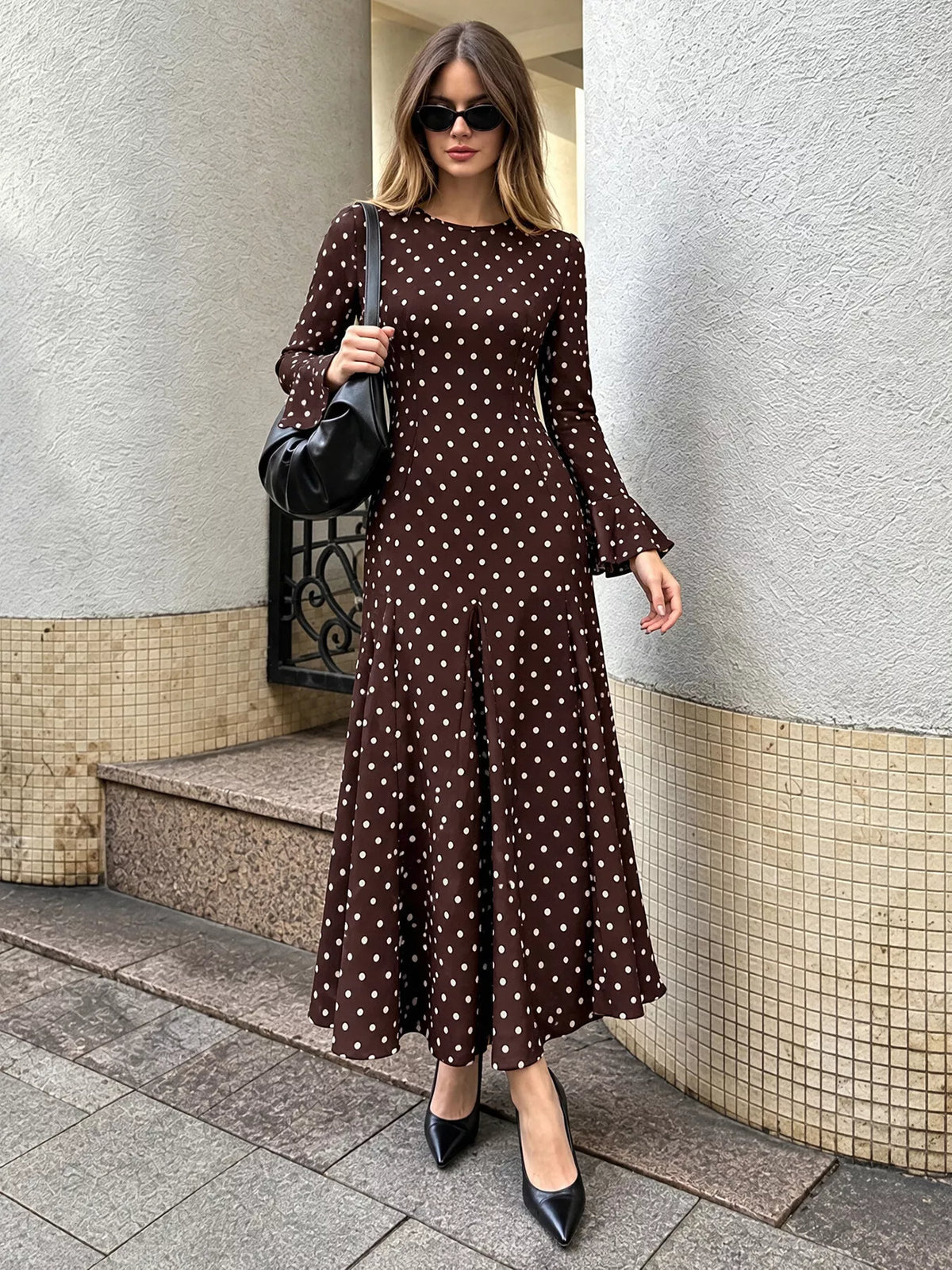 Coffee brown polka dot long-sleeve maxi dress, straight-on view with cuffed sleeves