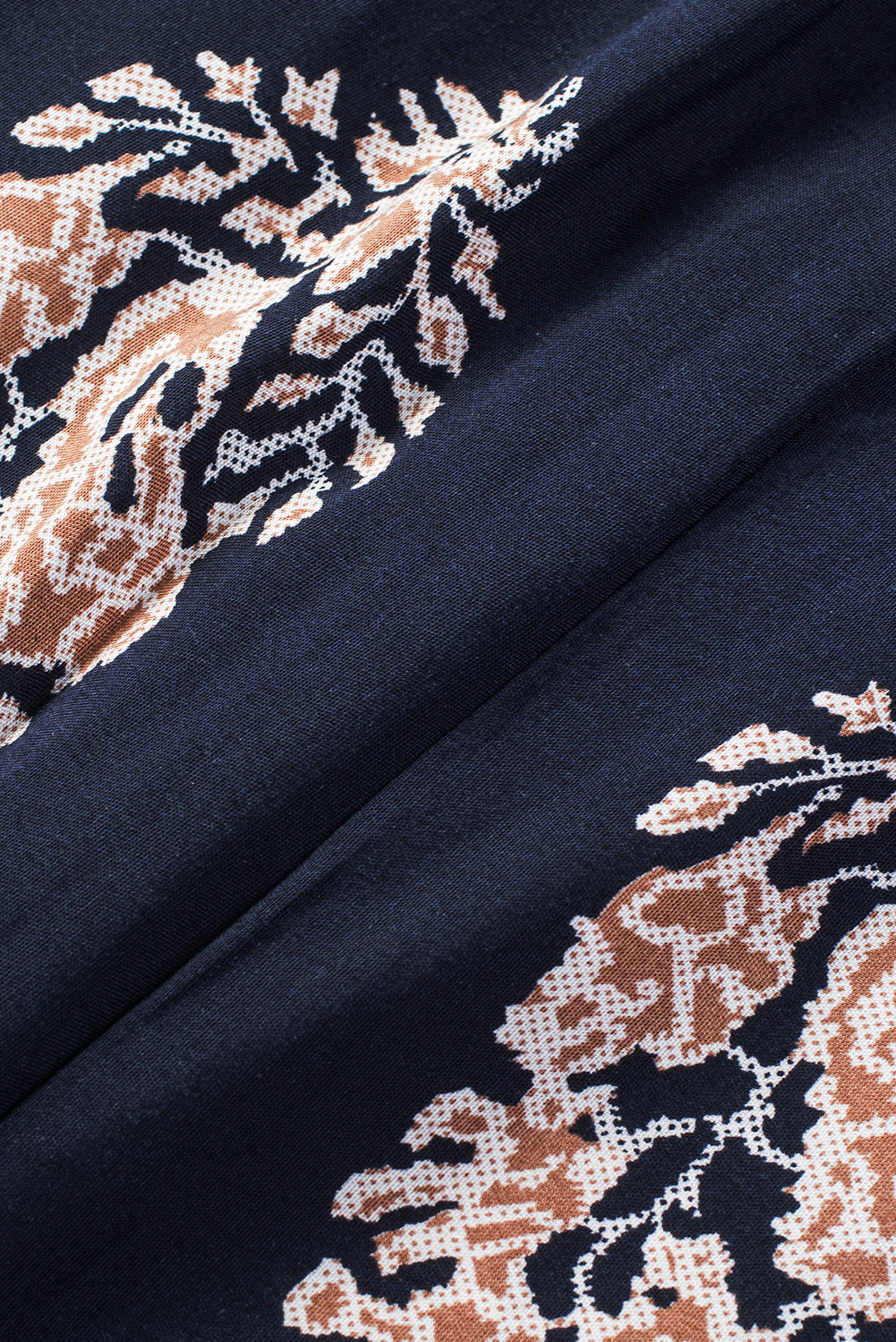 Dark blue printed fabric with detailed floral motifs
