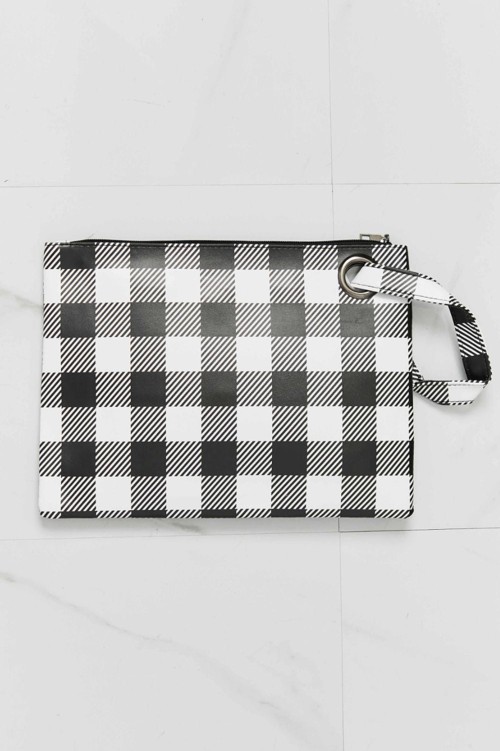 Black and white plaid wristlet pouch with zipper pull and wrist strap loop