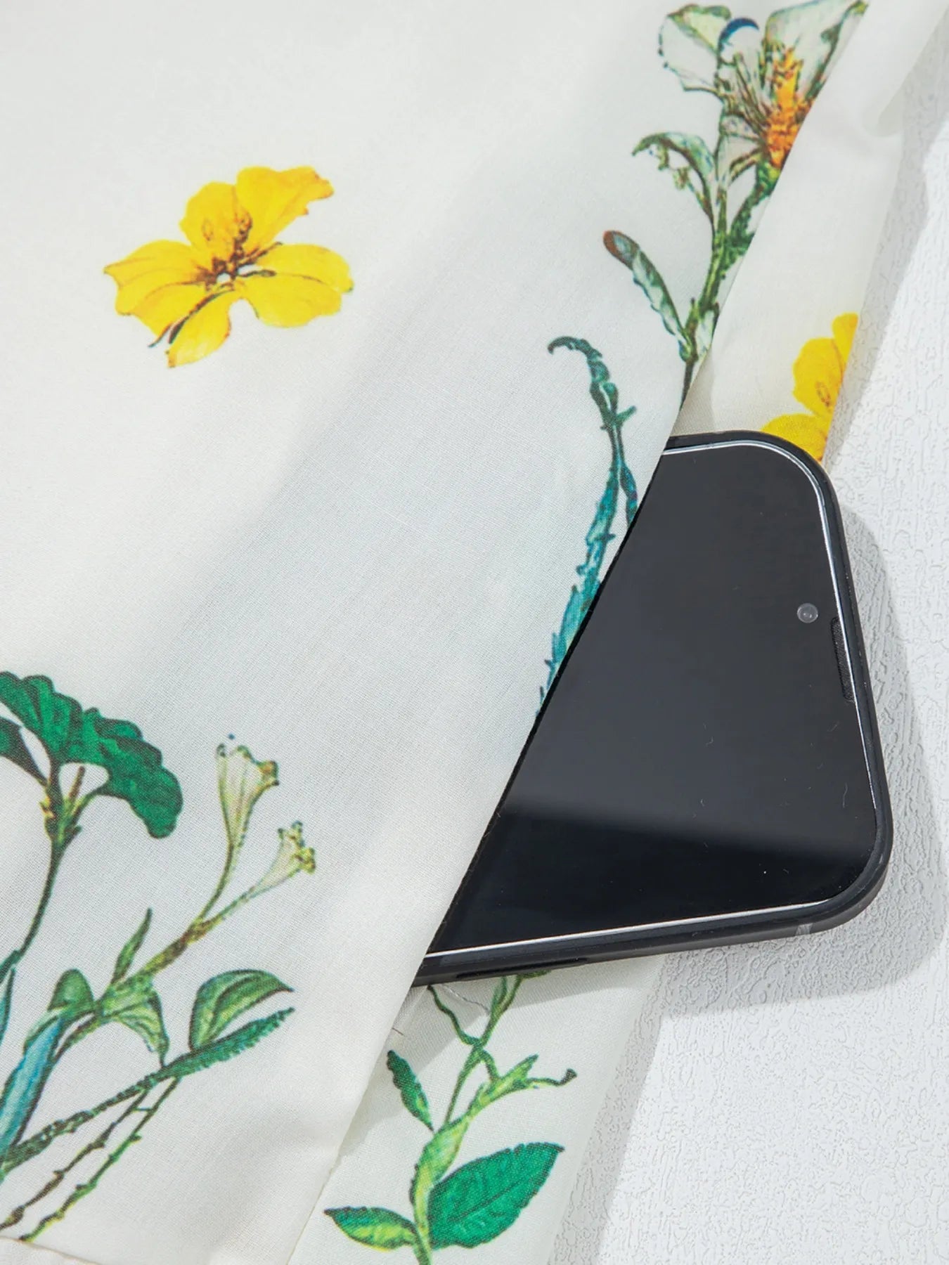 Floral Print Notched Short Sleeve Dress fabric close-up with yellow flowers and green stems on white background