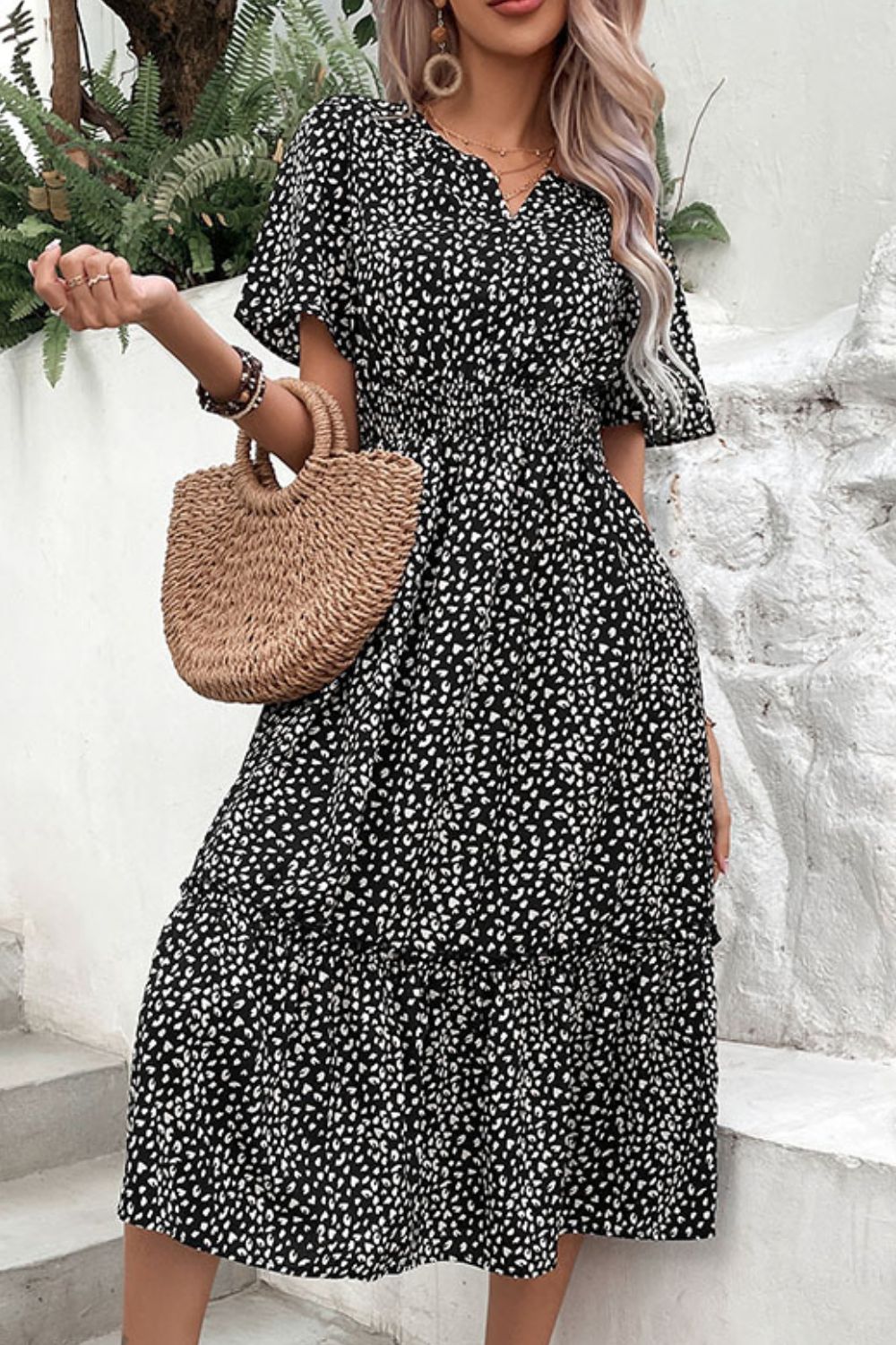 Black leopard print midi dress with short sleeves and V-neck, tiered skirt